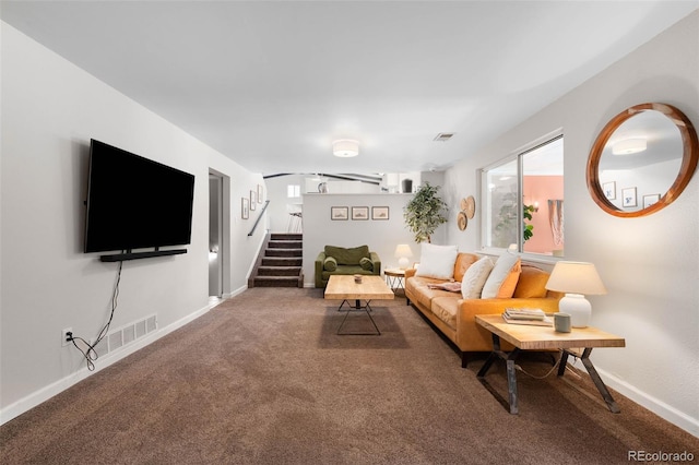 7371 Otis Ct, Arvada, CO 80003 - carpeted living area featuring stairway and baseboards