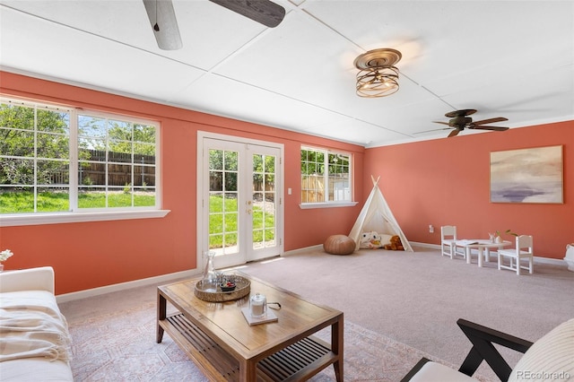 7371 Otis Ct, Arvada, CO 80003 - living area featuring ceiling fan, baseboards, french doors, and carpet flooring