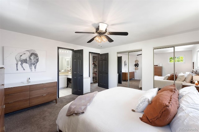 7371 Otis Ct, Arvada, CO 80003 - bedroom with carpet floors, multiple closets, ensuite bathroom, and ceiling fan