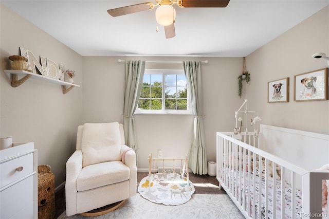 7371 Otis Ct, Arvada, CO 80003 - bedroom with a crib, ceiling fan, and carpet