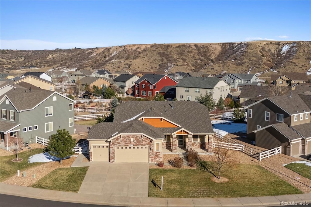 birds eye view of property with a mountain view