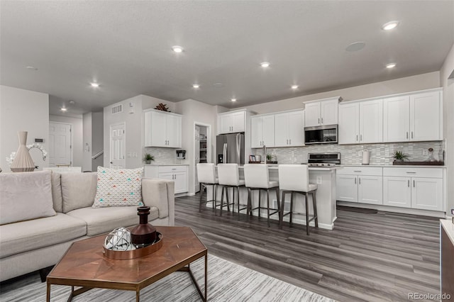 living room featuring dark wood-type flooring