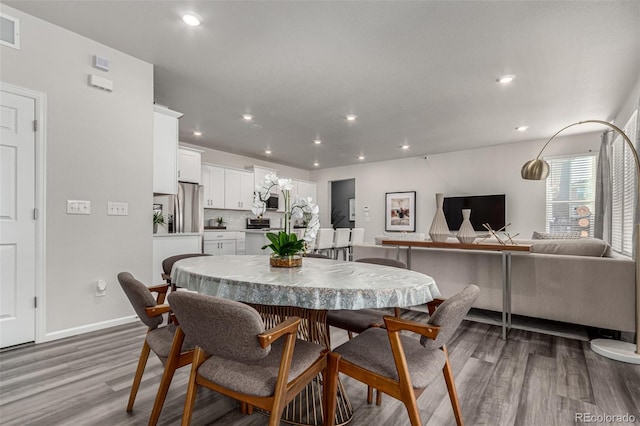 dining area with light hardwood / wood-style flooring