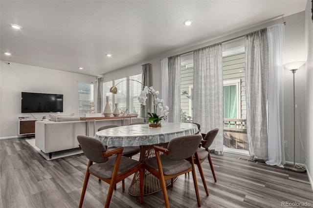 dining area with hardwood / wood-style flooring