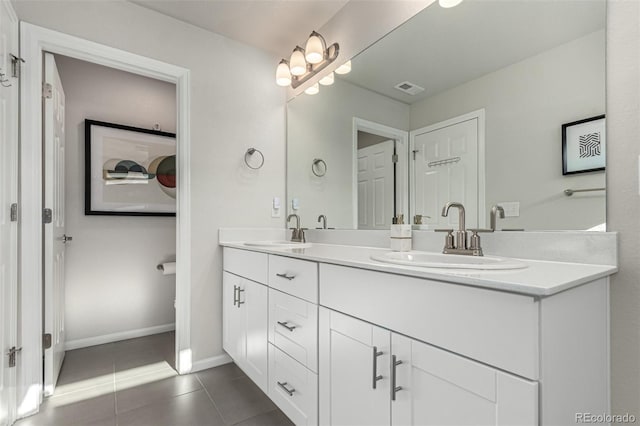 bathroom featuring tile patterned floors and vanity