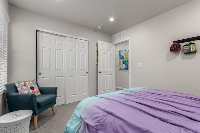 carpeted bedroom featuring a closet