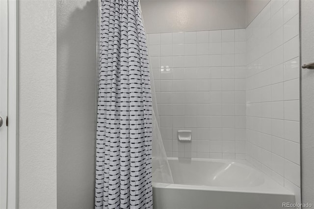 bathroom with shower / bathtub combination with curtain