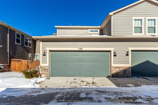 view of snow covered garage