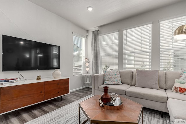 1126 S Yampa St, Aurora, CO 80017 - living room with dark wood-style floors and baseboards