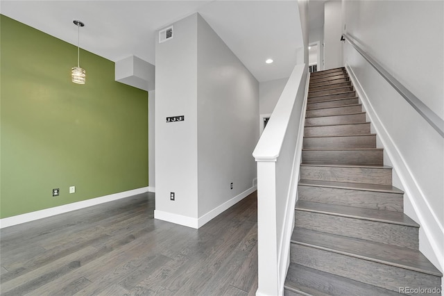 stairs with hardwood / wood-style flooring