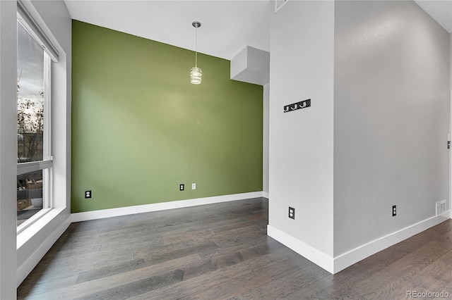 spare room featuring dark hardwood / wood-style floors