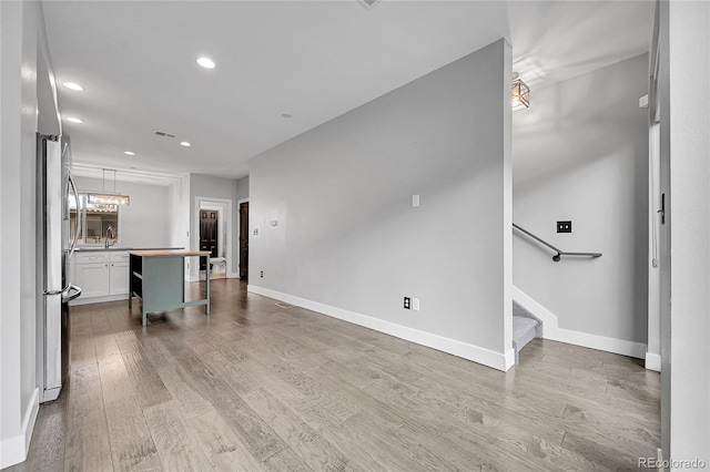 unfurnished living room featuring wood-type flooring