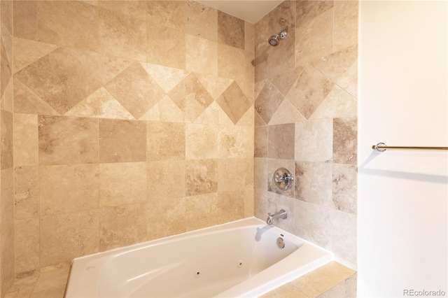 full bath featuring tiled shower / bath