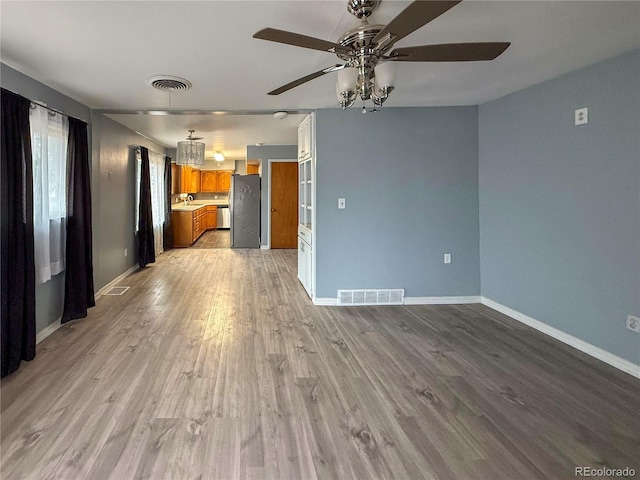 163 Pomeroy St, Burlington, CO 80807 - unfurnished living room featuring ceiling fan and light wood-type flooring
