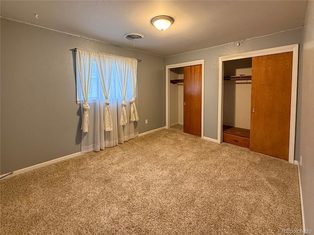 163 Pomeroy St, Burlington, CO 80807 - unfurnished bedroom with multiple closets and carpet floors