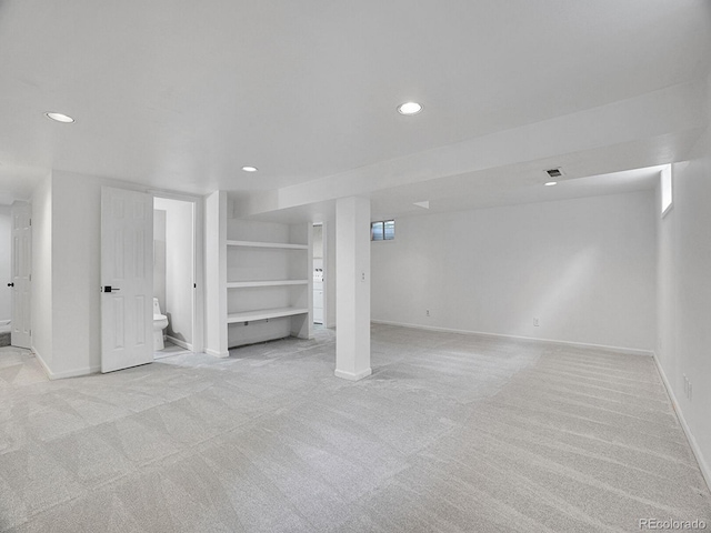 4670 E Euclid Cir, Centennial, CO 80121 - finished basement featuring light carpet, recessed lighting, baseboards, stairs, and built in shelves