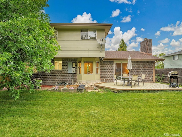 4670 E Euclid Cir, Centennial, CO 80121 - rear view of property featuring brick siding, a chimney, and a deck