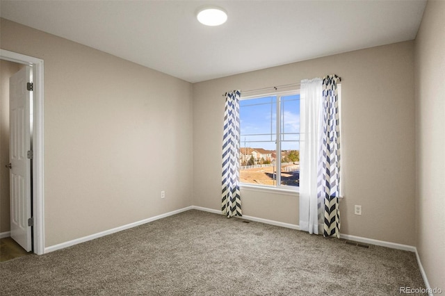 spare room featuring carpet floors