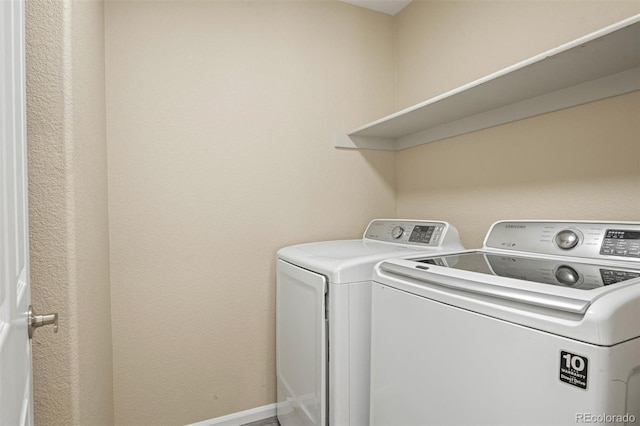 laundry area with washing machine and dryer