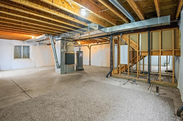 basement with gas water heater and heating unit