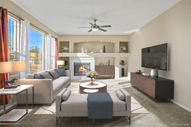 carpeted living room featuring ceiling fan and built in features