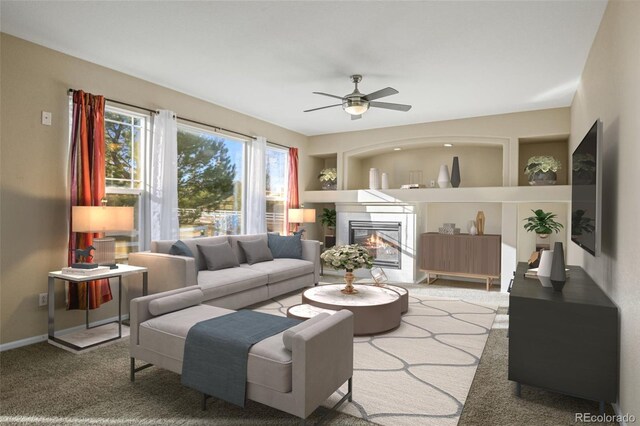 carpeted living room with ceiling fan and built in features