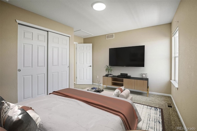 bedroom with carpet flooring and a closet