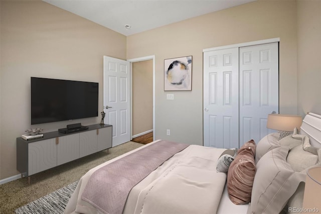 carpeted bedroom with a closet