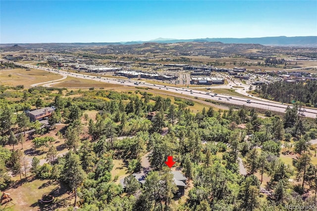 birds eye view of property with a mountain view