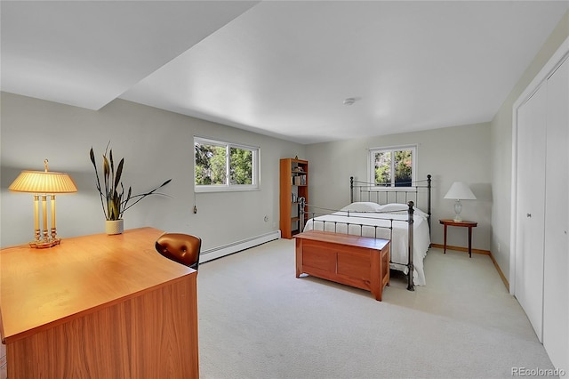 bedroom featuring baseboard heating, light carpet, and multiple windows