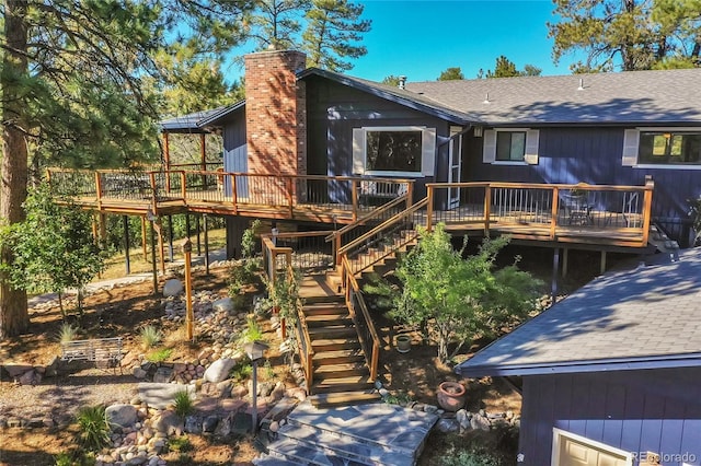 back of property featuring a wooden deck