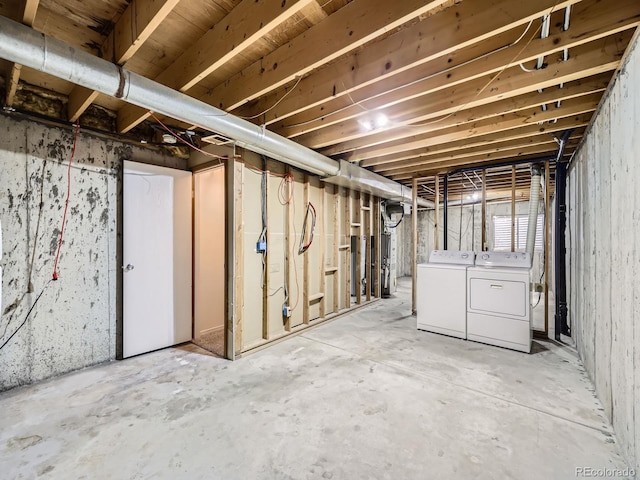 basement featuring washing machine and clothes dryer