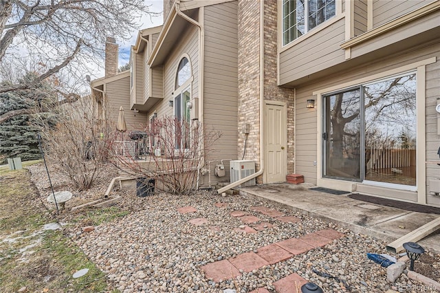 view of property exterior with a patio area