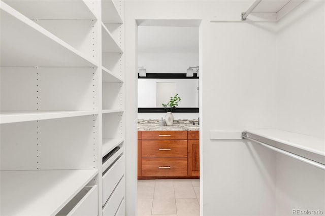 spacious closet featuring light tile patterned flooring