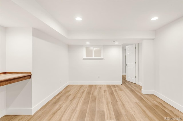 basement with recessed lighting, baseboards, and light wood finished floors