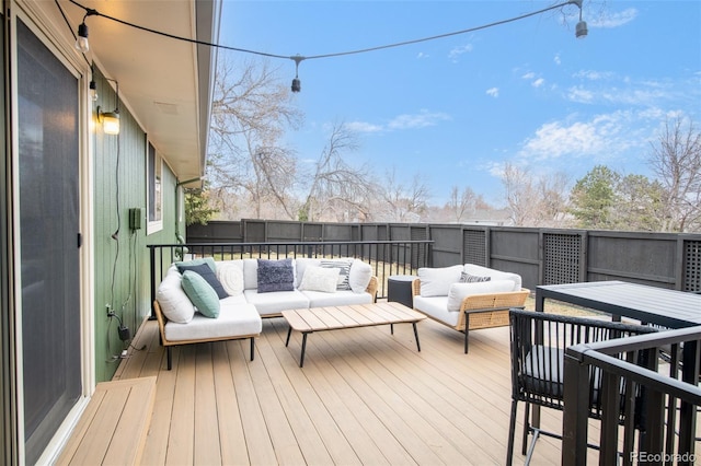 wooden deck featuring outdoor lounge area