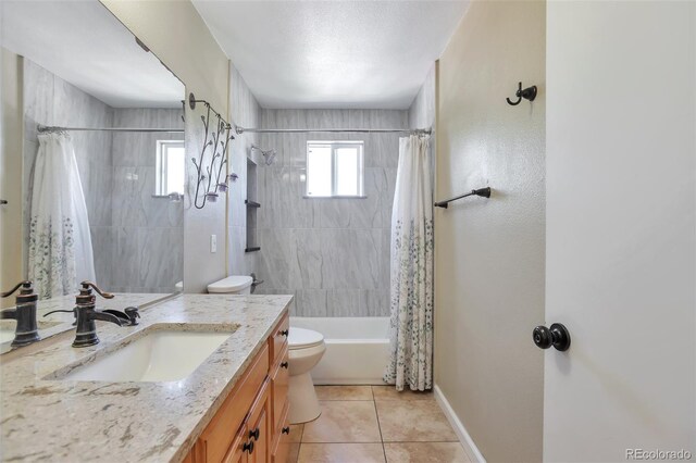 12333 Newport Ct, Brighton, CO 80602 - full bathroom with toilet, tile patterned floors, shower / bathtub combination with curtain, vanity, and baseboards