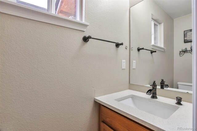 12333 Newport Ct, Brighton, CO 80602 - bathroom with vanity and toilet