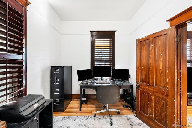 office area featuring a wealth of natural light and light wood-type flooring