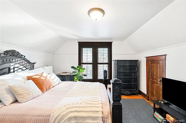 bedroom with lofted ceiling