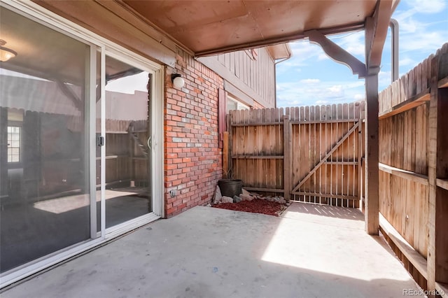 view of patio / terrace featuring a gate and fence