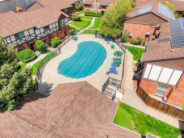 view of swimming pool with fence and a gate