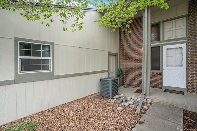 3405 W 16th St Unit 14C, Greeley, CO 80634 - view of home's exterior featuring cooling unit and brick siding