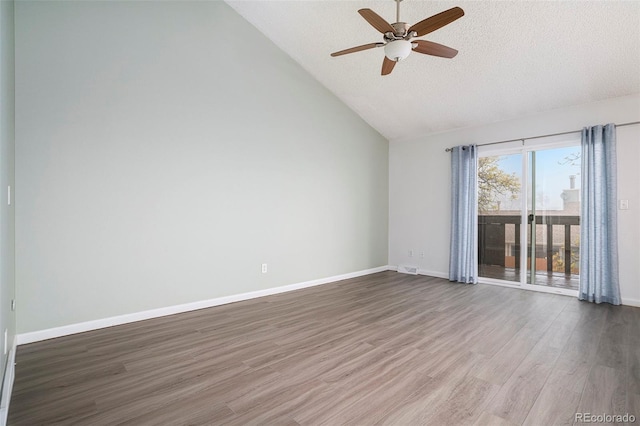 3405 W 16th St Unit 14C, Greeley, CO 80634 - spare room featuring a ceiling fan, a textured ceiling, wood finished floors, baseboards, and high vaulted ceiling