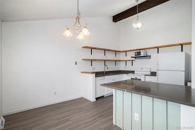 3405 W 16th St Unit 14C, Greeley, CO 80634 - kitchen featuring white appliances, open shelves, dark countertops, and white cabinets