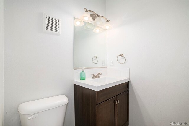 3405 W 16th St Unit 14C, Greeley, CO 80634 - half bathroom featuring vanity and toilet