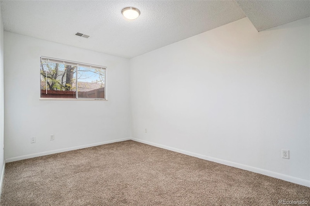 3405 W 16th St Unit 14C, Greeley, CO 80634 - unfurnished room with carpet flooring, a textured ceiling, and baseboards