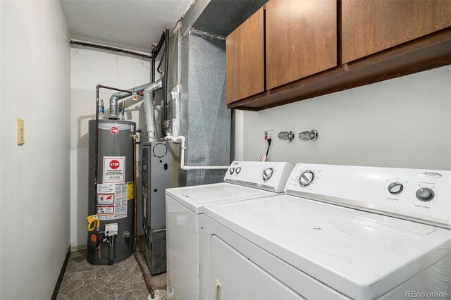 3405 W 16th St Unit 14C, Greeley, CO 80634 - laundry area with water heater, cabinet space, and washing machine and dryer