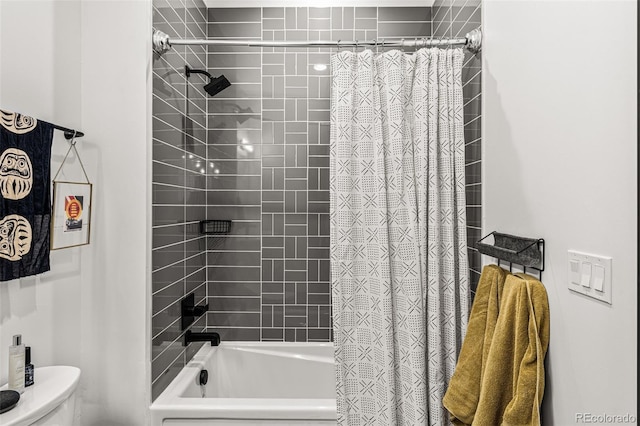 bathroom with toilet and shower / tub combo with curtain