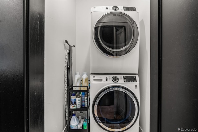 washroom with stacked washer / drying machine